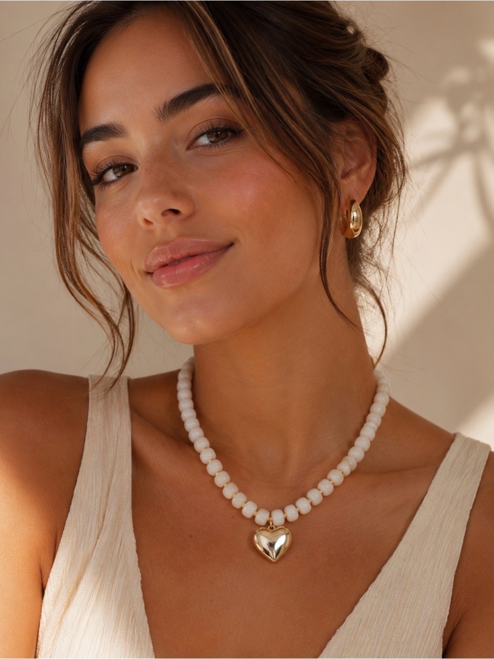 White Beaded Necklace with Gold Heart Pendant